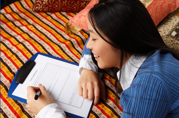 Girl filling out Cyber Security course form.