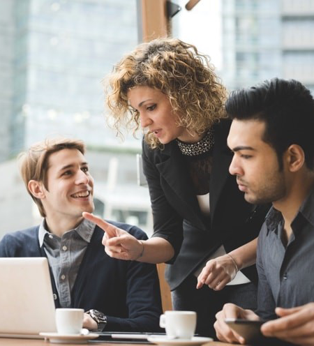 Team collaborating at a laptop